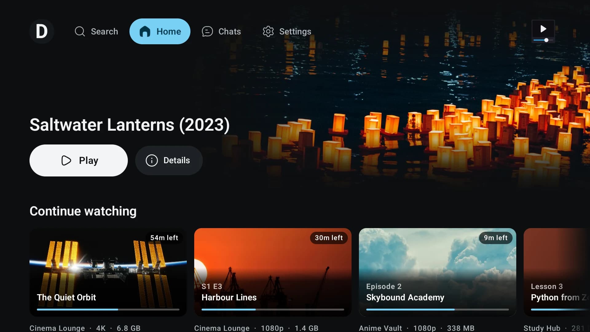 TMPlayer's Home on a TV in 1.27: a top bar with the profile, Search, Home, Chats and Settings, a large carousel card with Play and Details, and a Continue watching row below