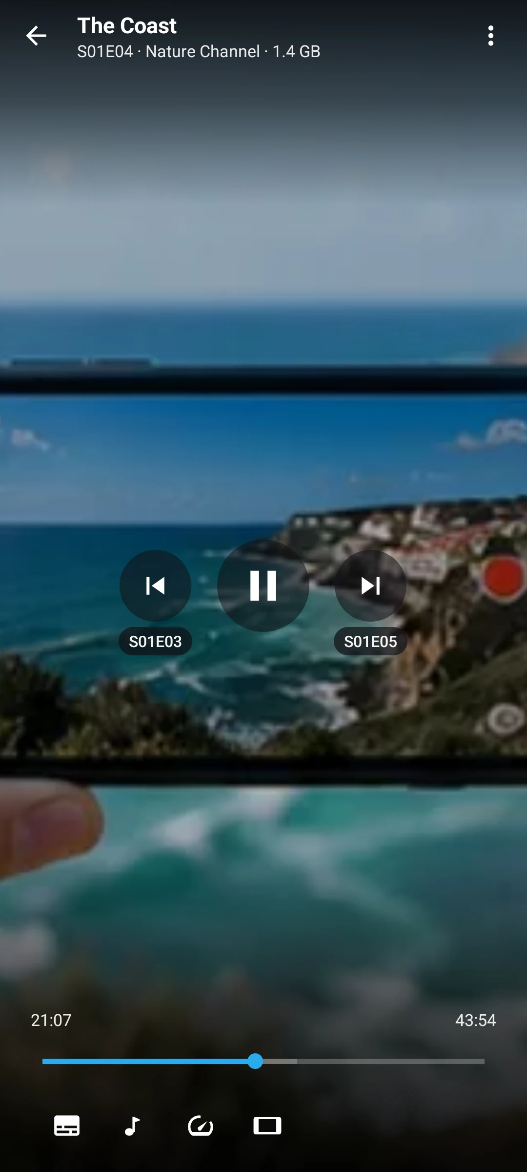 The phone player on an episode, titled with its season and episode, with previous and next episode buttons